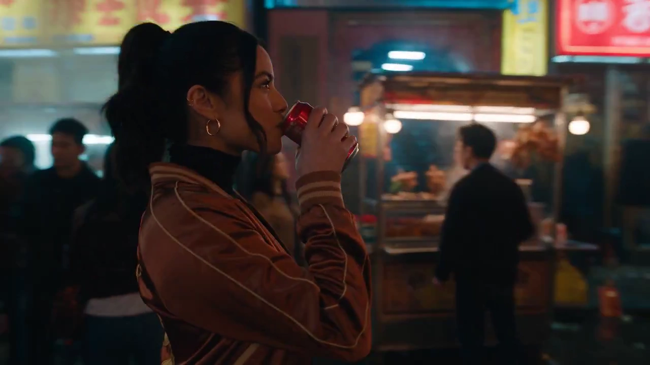 Unbothered Woman Walks Away After Blasting Monster in Neon Market