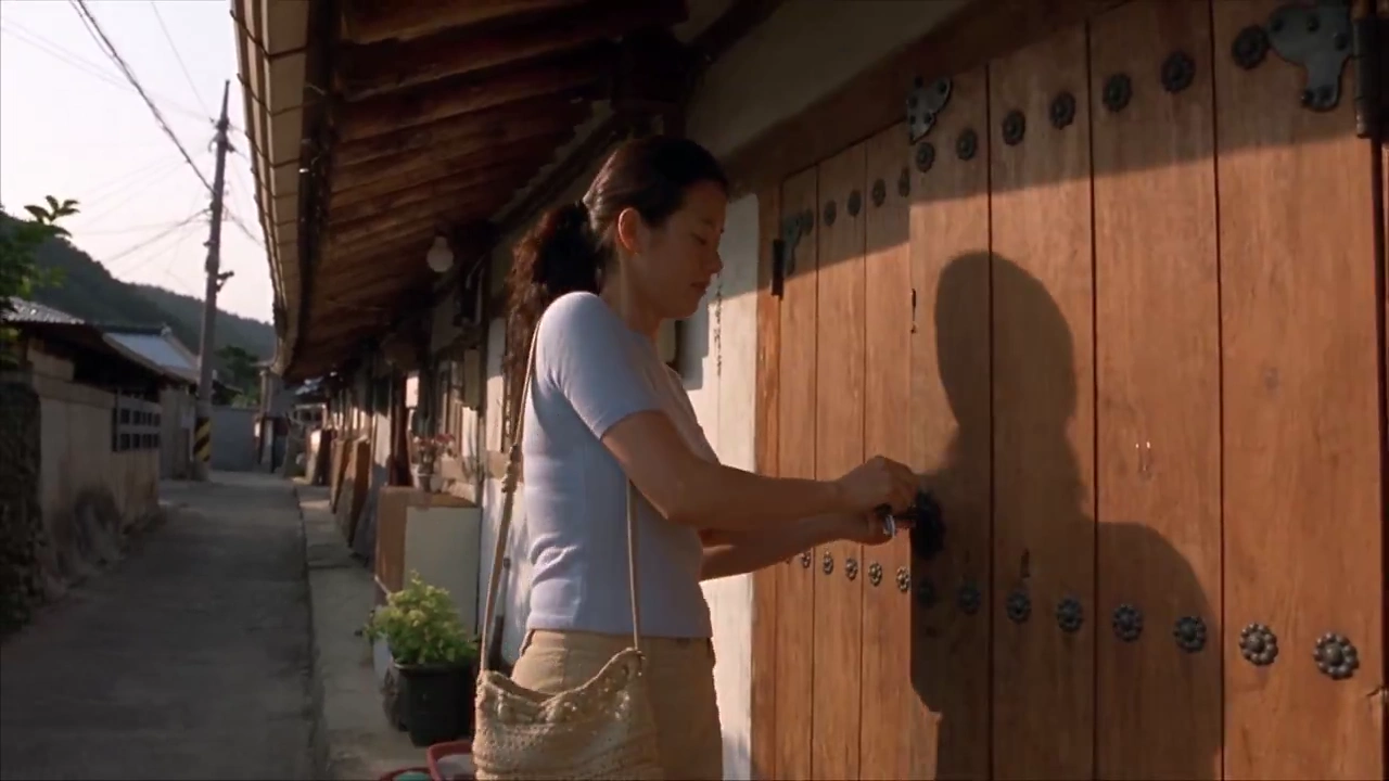 Handheld MiniDV Footage Shows Woman Walking Through Korean Village
