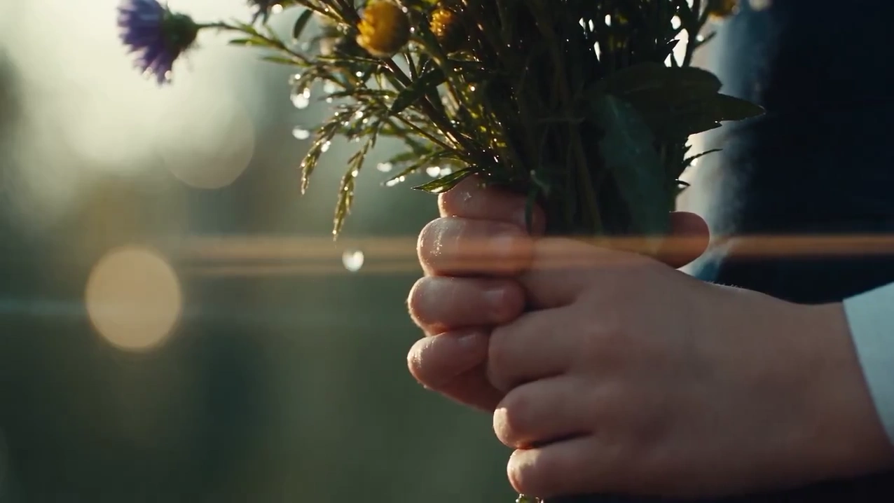 Tearful Child Stands Alone in Courtyard with Wildflower Bouquet