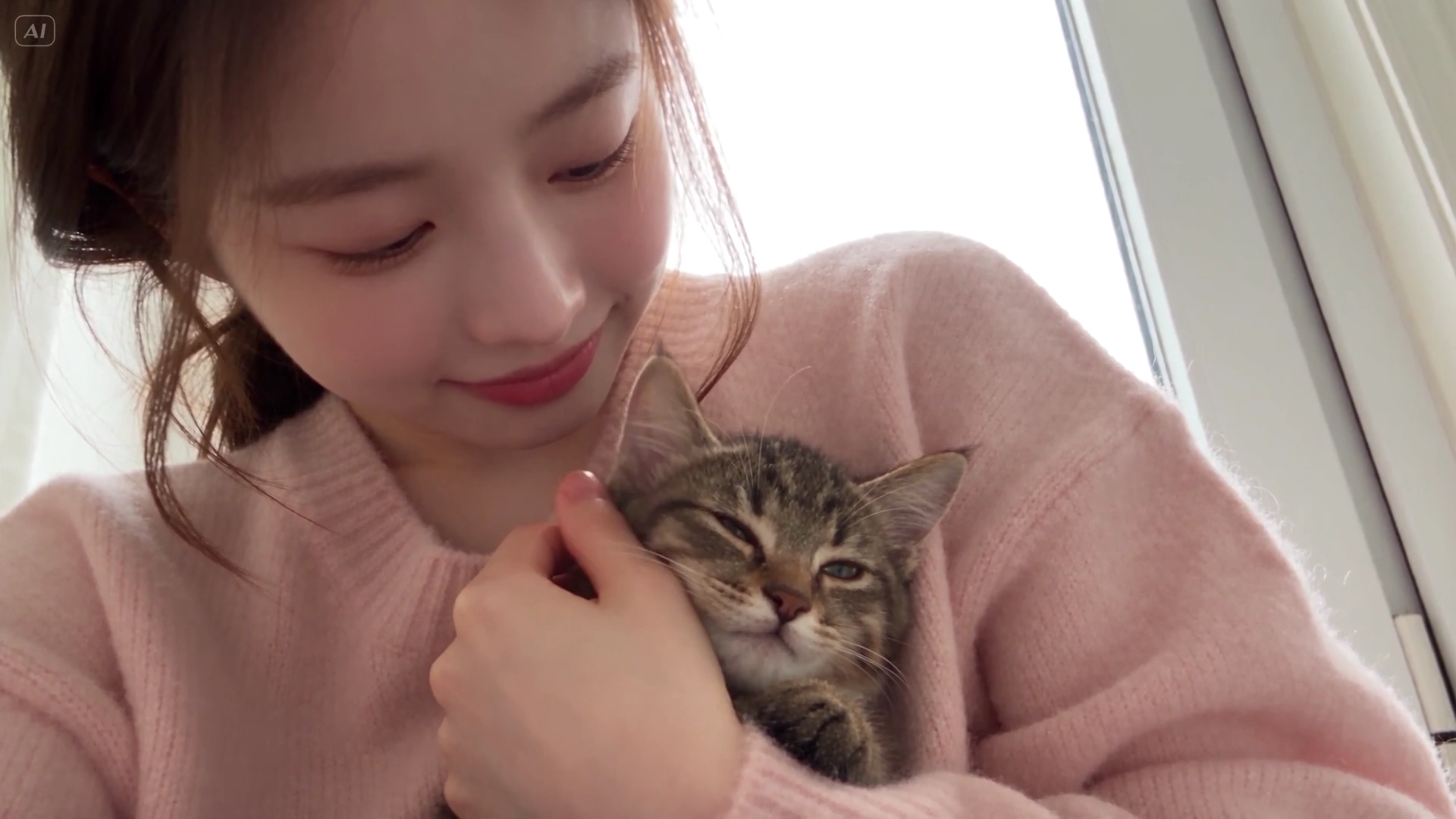 Woman Laughs As Her Kitten Climbs Chest and Reaches For Phone