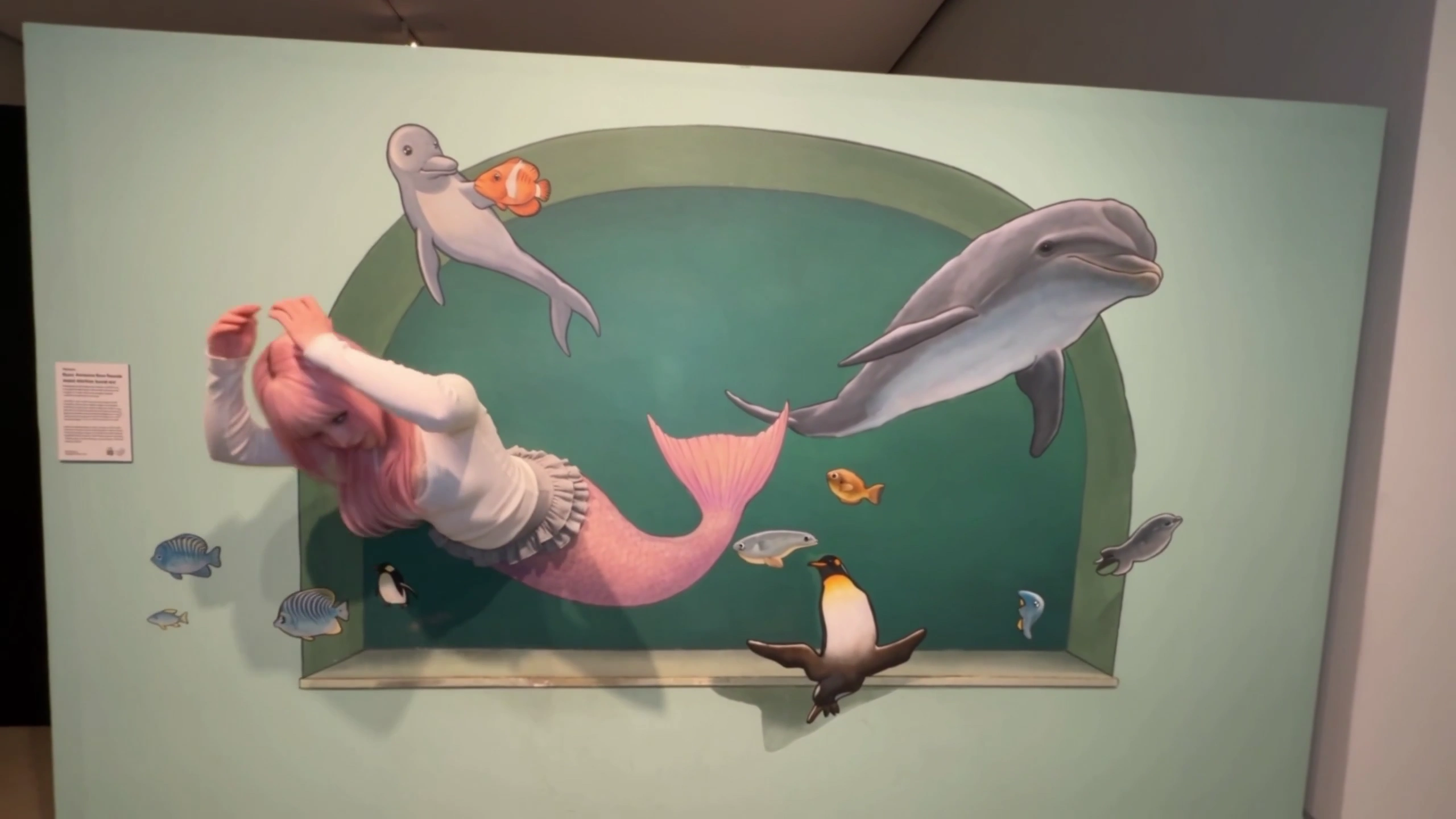 Woman in Sequined Tail Poses as Living Art in Beluga Gallery