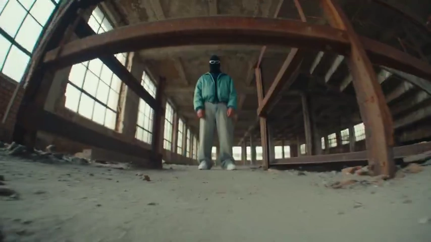 Two Streetwear Figures Trade Dominance Inside a Crumbling Industrial Building
