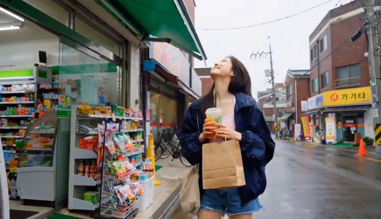 Analogue VHS Footage Shows Rainy Street Errand With Friendly Wave