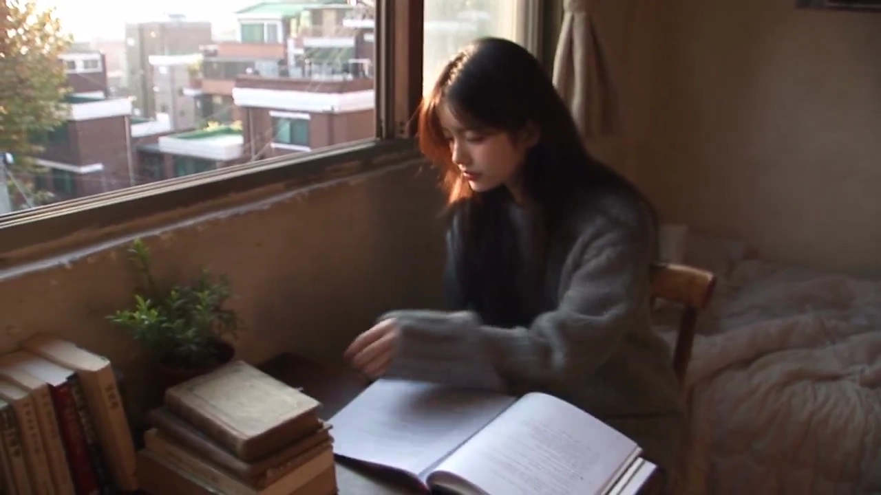 Candid MiniDV Clip Captures Girl Launching Paper Plane from Apartment