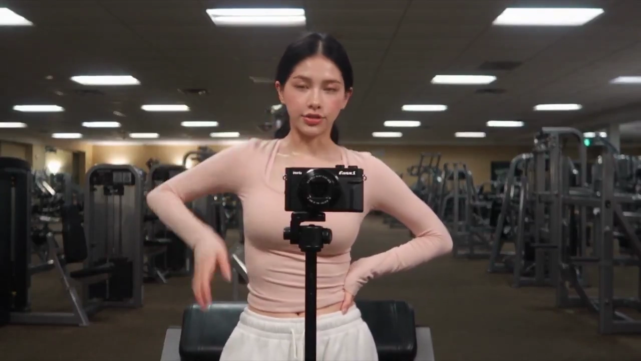Handheld Tape POV Follows a Ponytail Through a Cozy Evening Gym