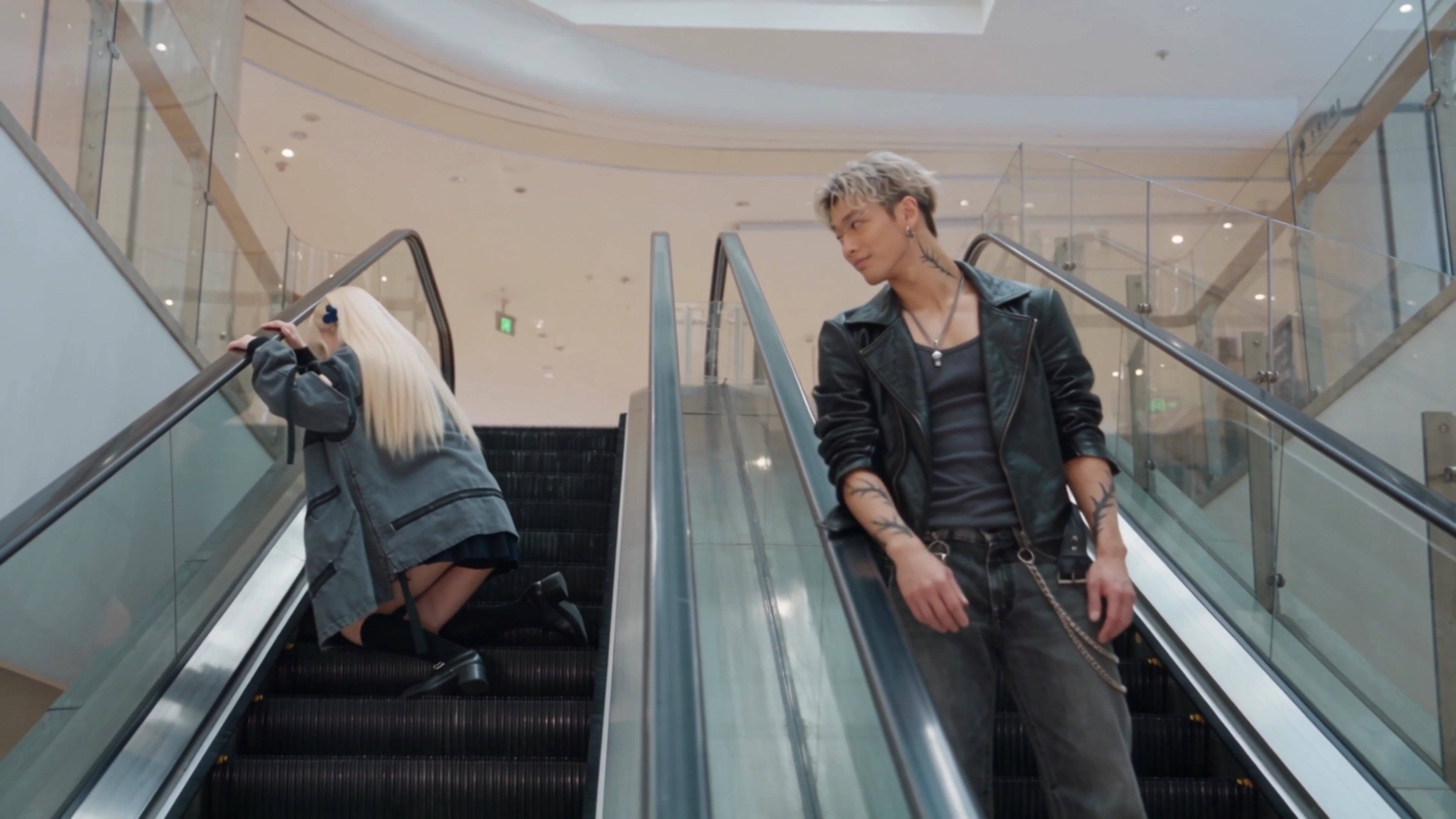 Reversed Escalator Sprint Ends With Knee Strike Against Ad Wall