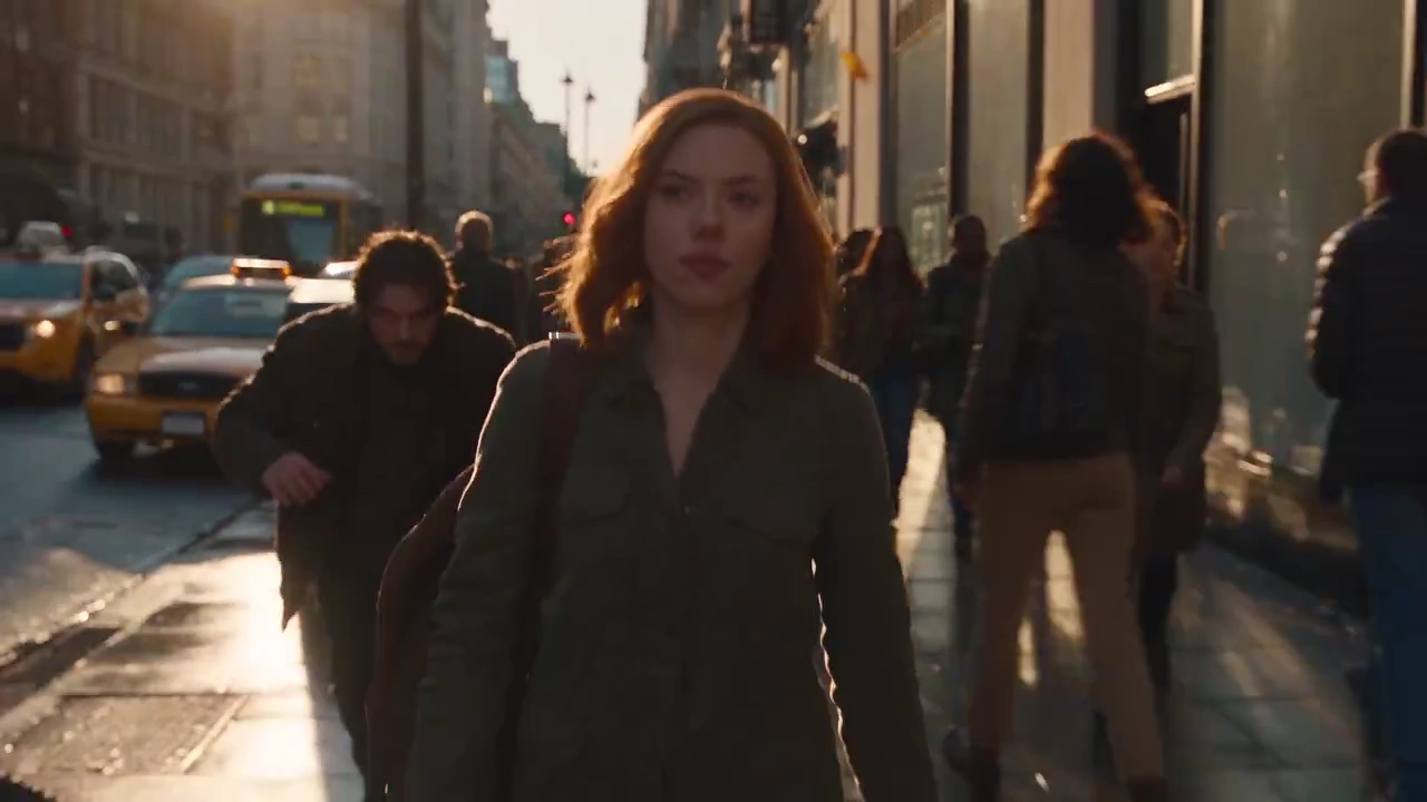 Mysterious Man Emerges Behind Woman in Steam-Filled Downtown Thriller