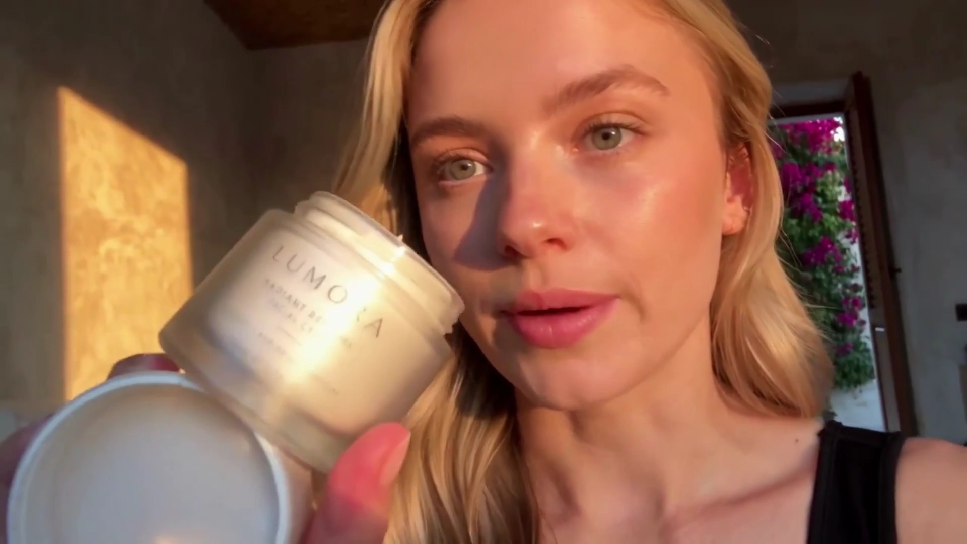 Radiant Skincare Ritual Unfolds in Warm Sunlit Bedroom With Bougainvillea