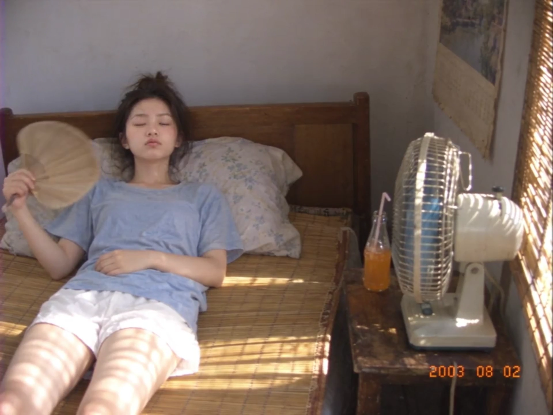 Nostalgic 2000s DV Footage of Girl Cooling Off in Old Apartment