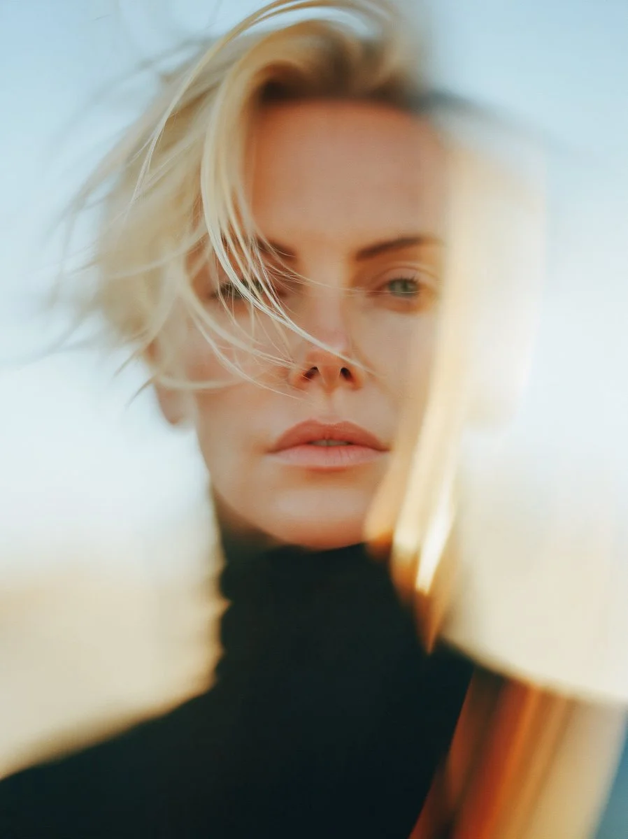 Dramatic light and motion create a cinematic Charlize Theron portrait