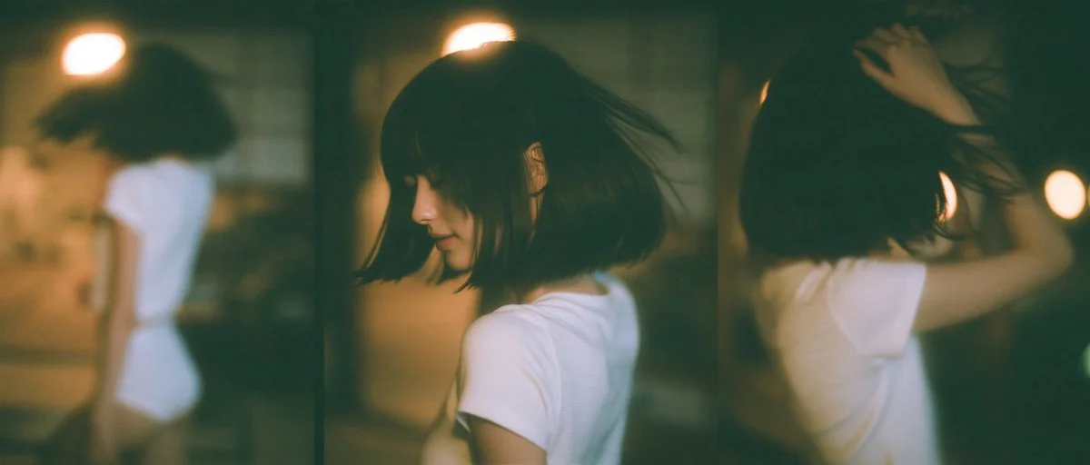Dramatic monochrome portrait of a woman in a tatami room at night
