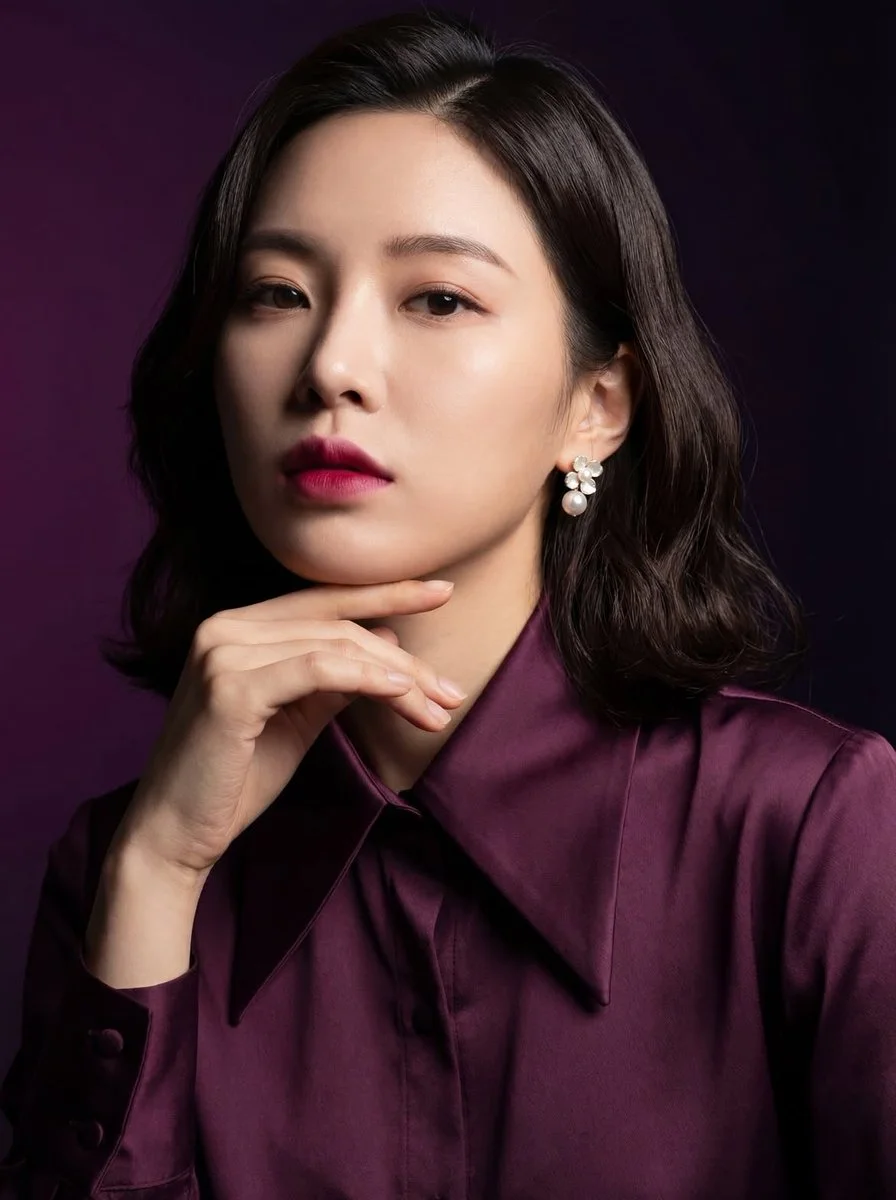 Elegant East Asian Woman in Plum Satin with Dramatic Lighting