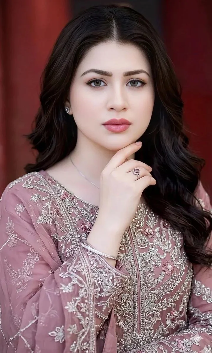 Elegant South Asian Woman Poses Gracefully in Dusty Rose Embroidered Dress