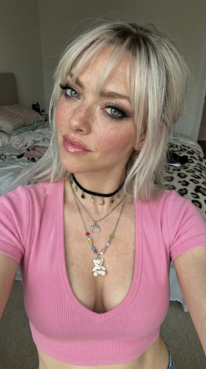 Freckled Beauty in a Playful Selfie with Glam Makeup