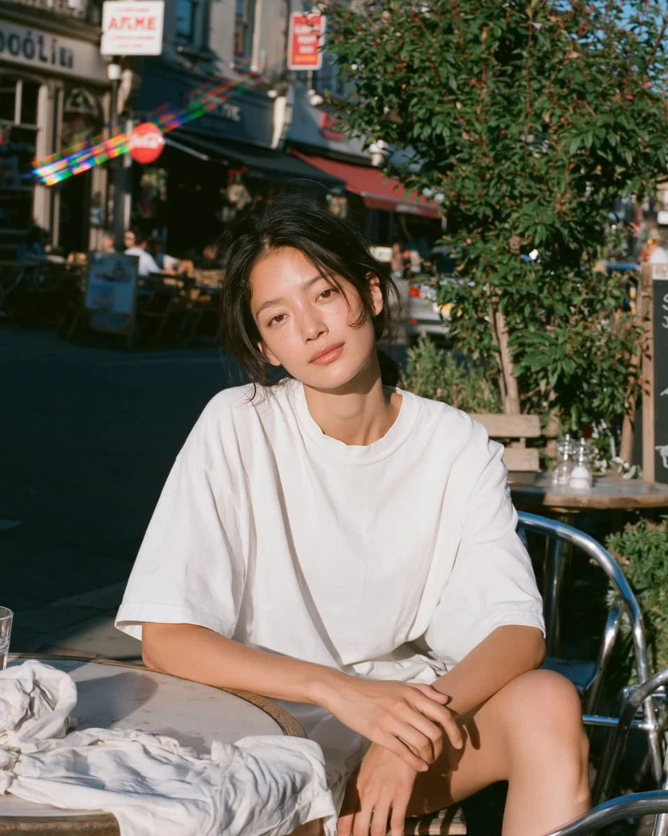 Golden hour portrait captures relaxed elegance at a café