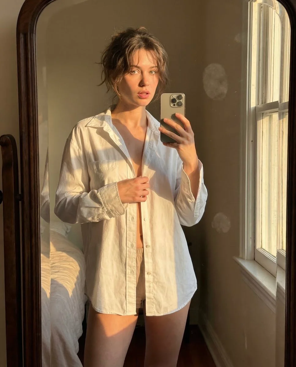 Golden Hour Reflection: Intimate Mirror Selfie in Soft Light