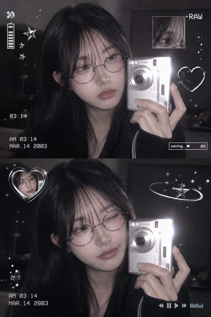 Korean girl in glasses takes mirror selfie with digicam