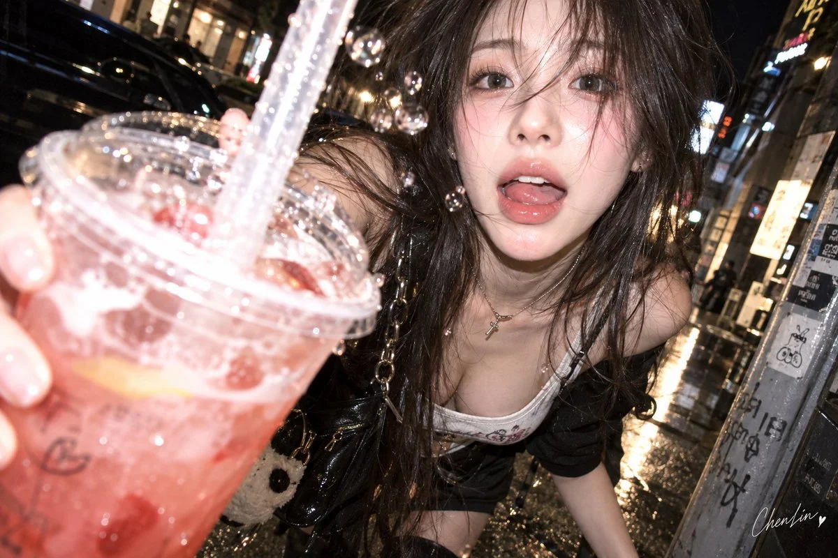 Korean sweet-cool woman thrusts iced drink toward camera with startled grin