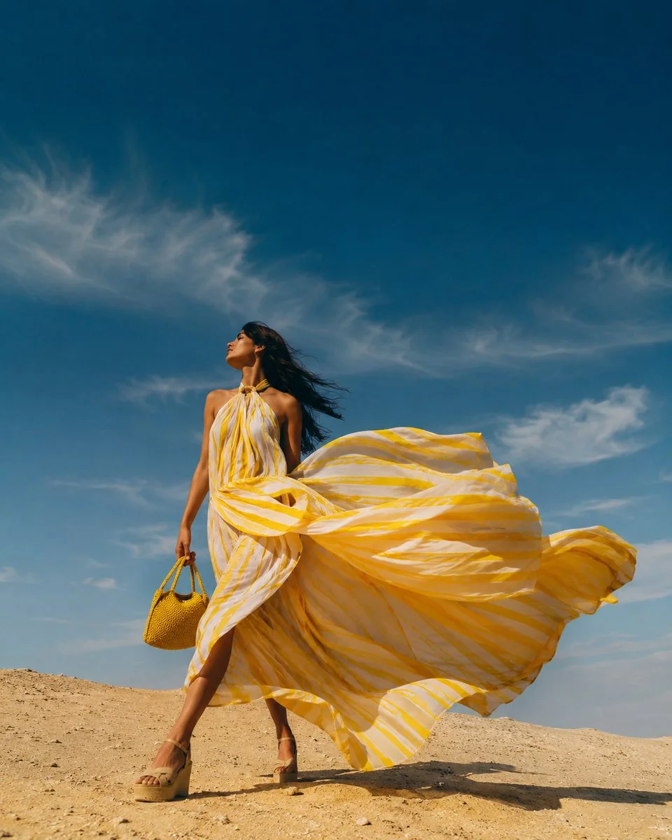 Low-angle shot captures model's serene expression against blue sky