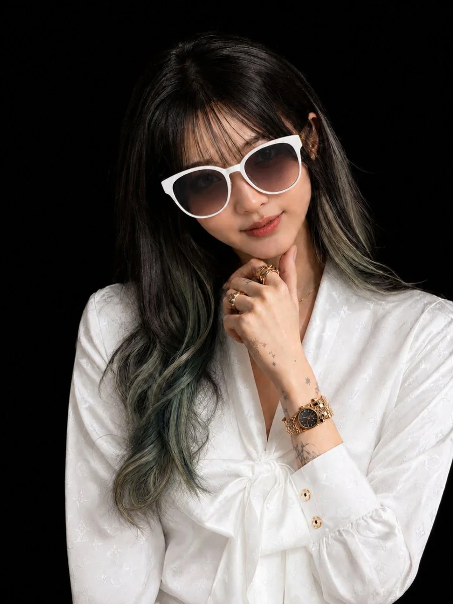Luxury fashion portrait with white satin blouse and gold sunglasses