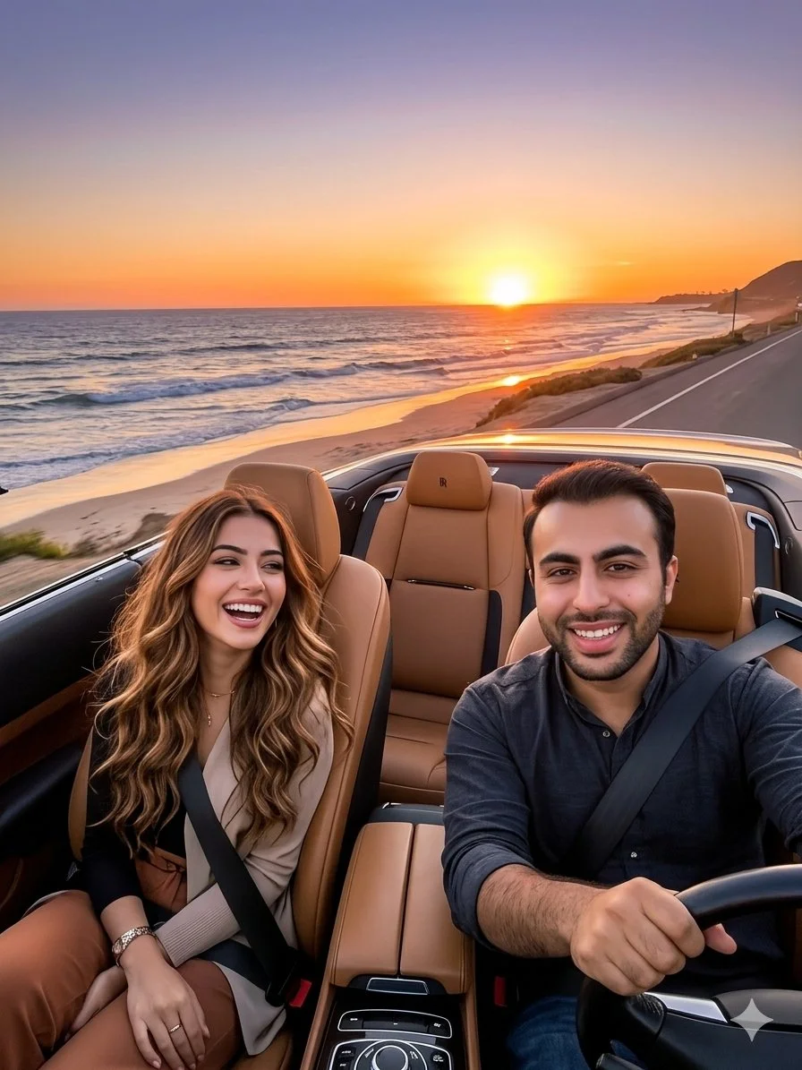 Man drives Rolls-Royce convertible at sunset along coastal road