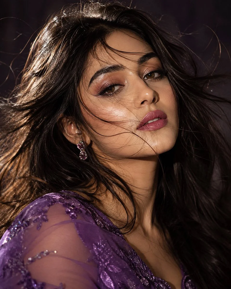 Moody glamour portrait of a woman with wind-tossed hair