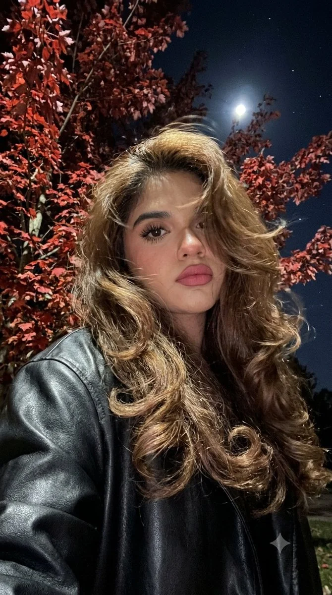 Moonlit selfie under red autumn leaves at night
