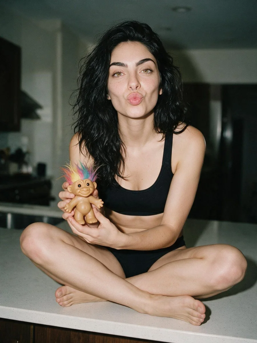 Nostalgic portrait of woman with Troll doll on kitchen island in film