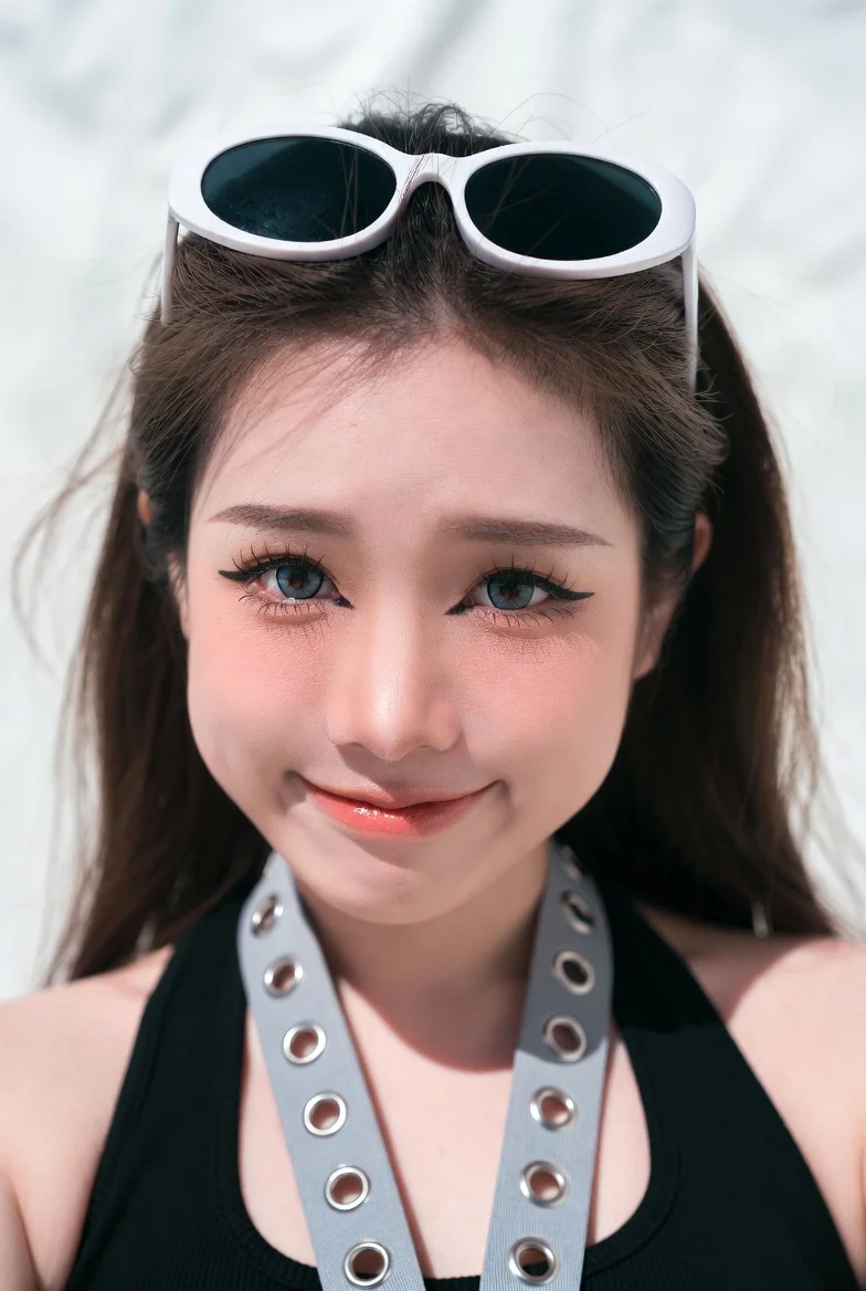 Playful selfie captures woman's expressive eyes and detailed skin texture