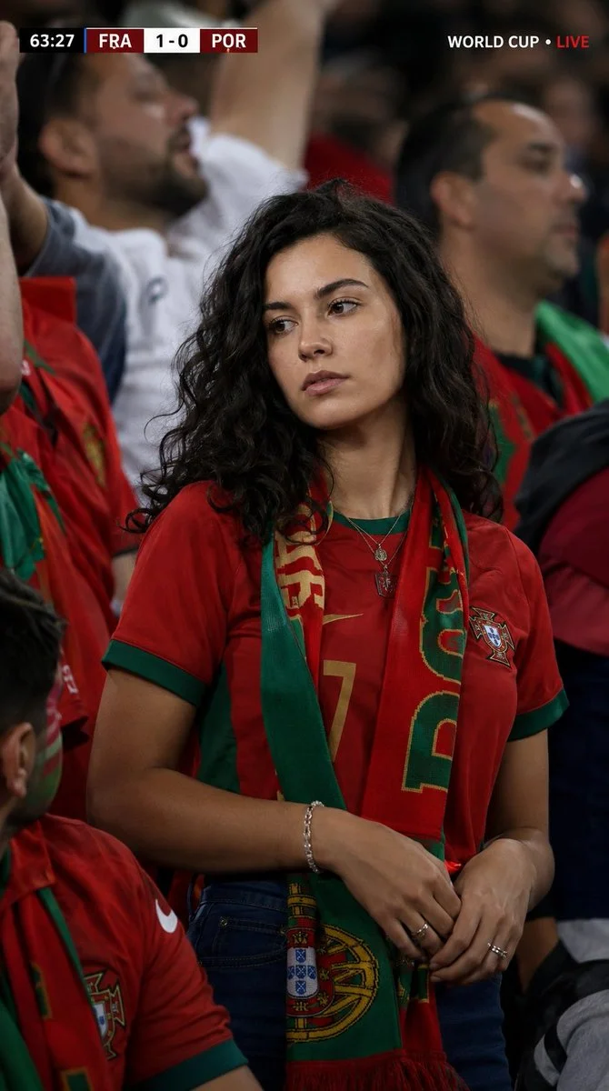 Portugal fan cheers intensely during World Cup match in stadium