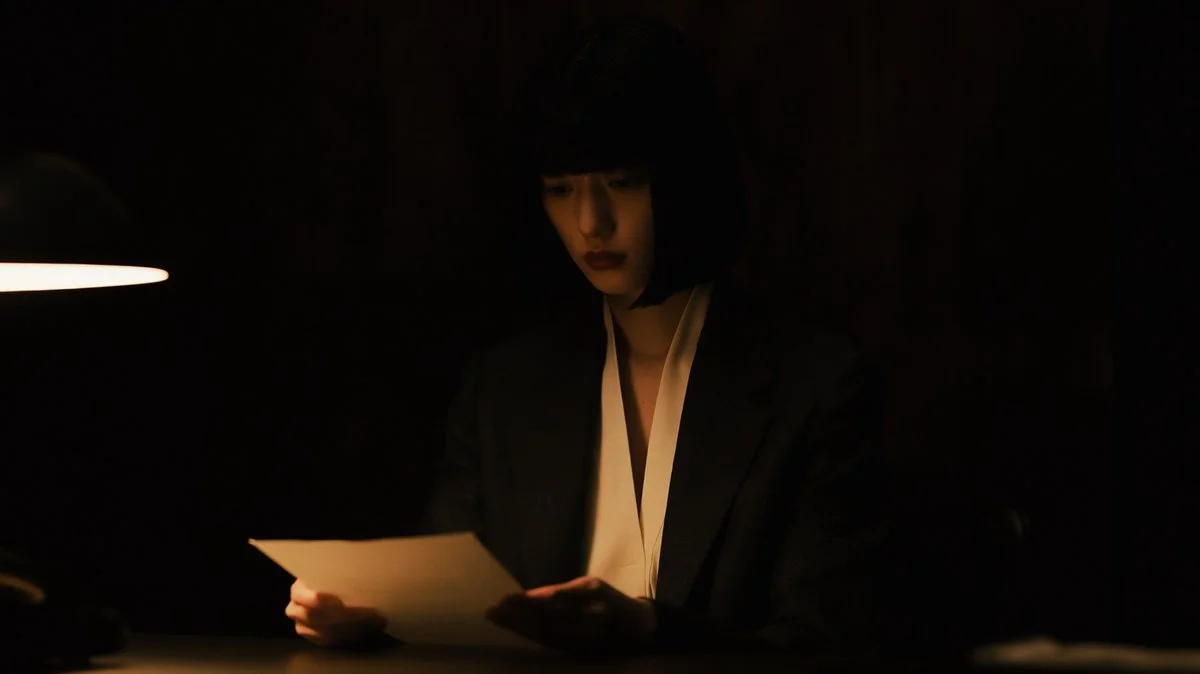Quiet Tension in the Shadows of a Low Key Portrait