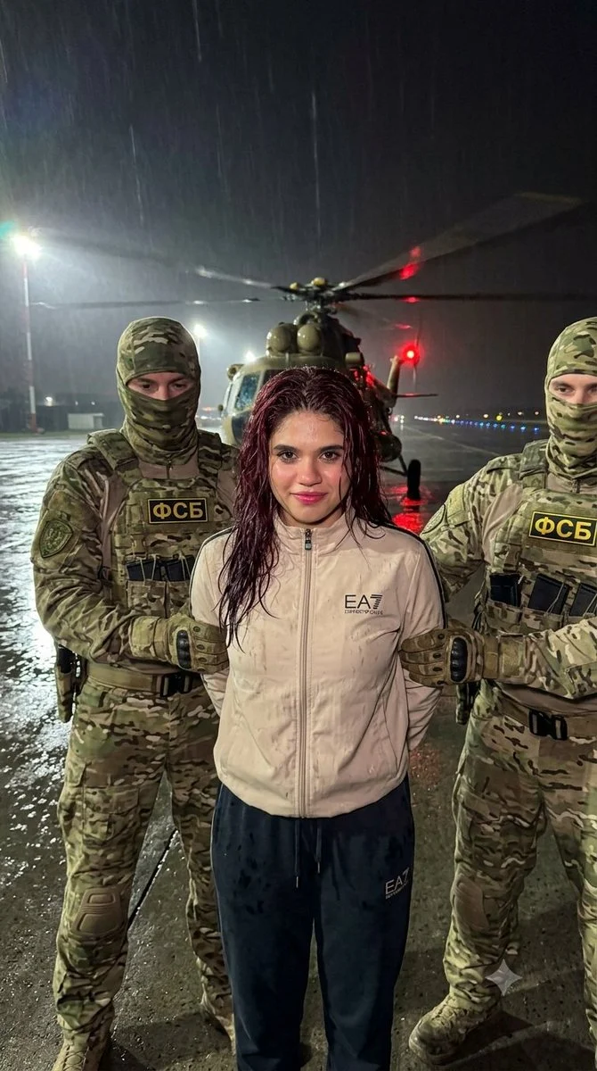 Rain-Soaked Runway Standoff: Officers Hold Woman, Helicopter Blades Spin