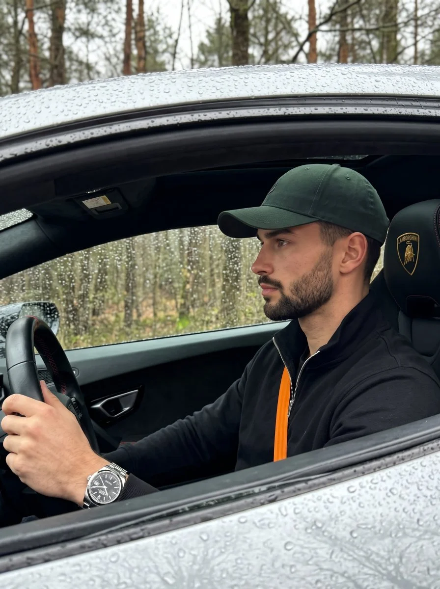 Rain-Speckled Luxury Car Portrait of a Calm Young Man