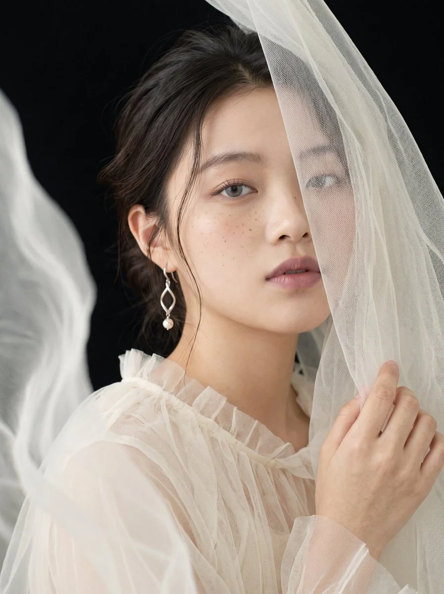 Sheer Tulle Veil Softens a Woman's Face in Fine-Art Portrait