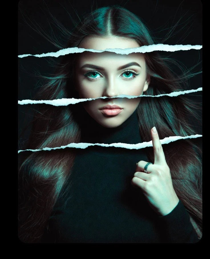 Side profile of woman with turquoise eyes sliced by torn paper layers