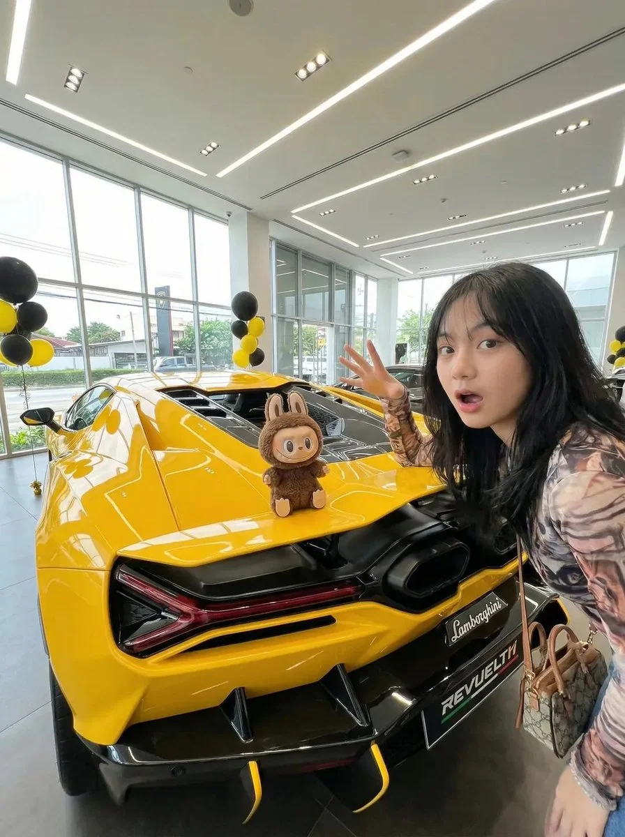Sleek Yellow Sports Car Showroom with Surprised Woman and Plush Toy