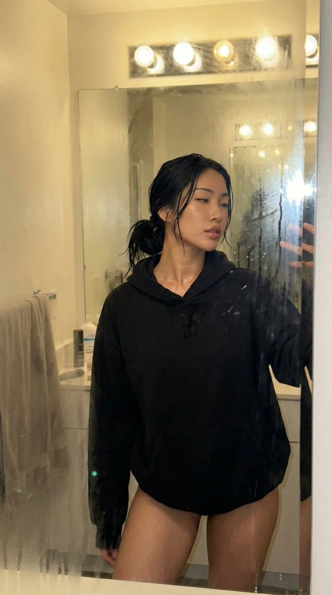 Steamy Mirror Selfie: A Bold Post-Shower Moment