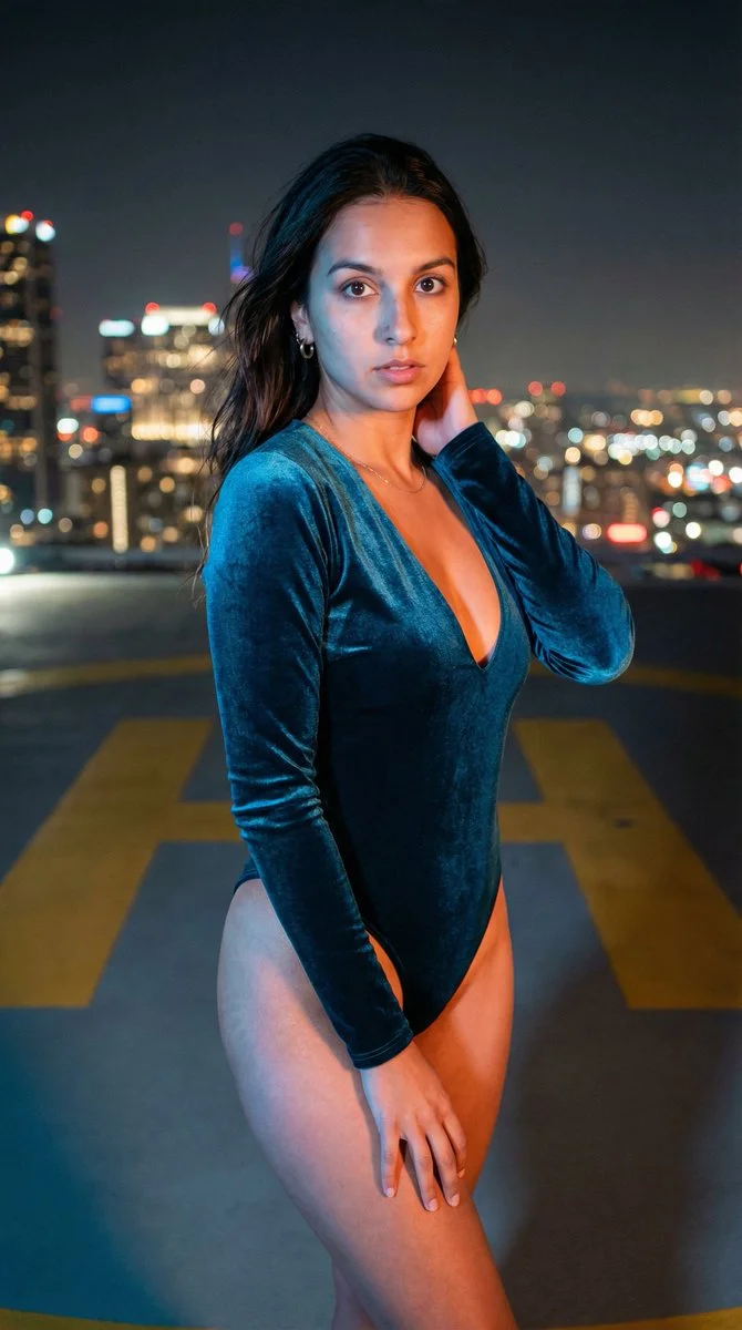 Striking Teal Elegance on a Night Helipad