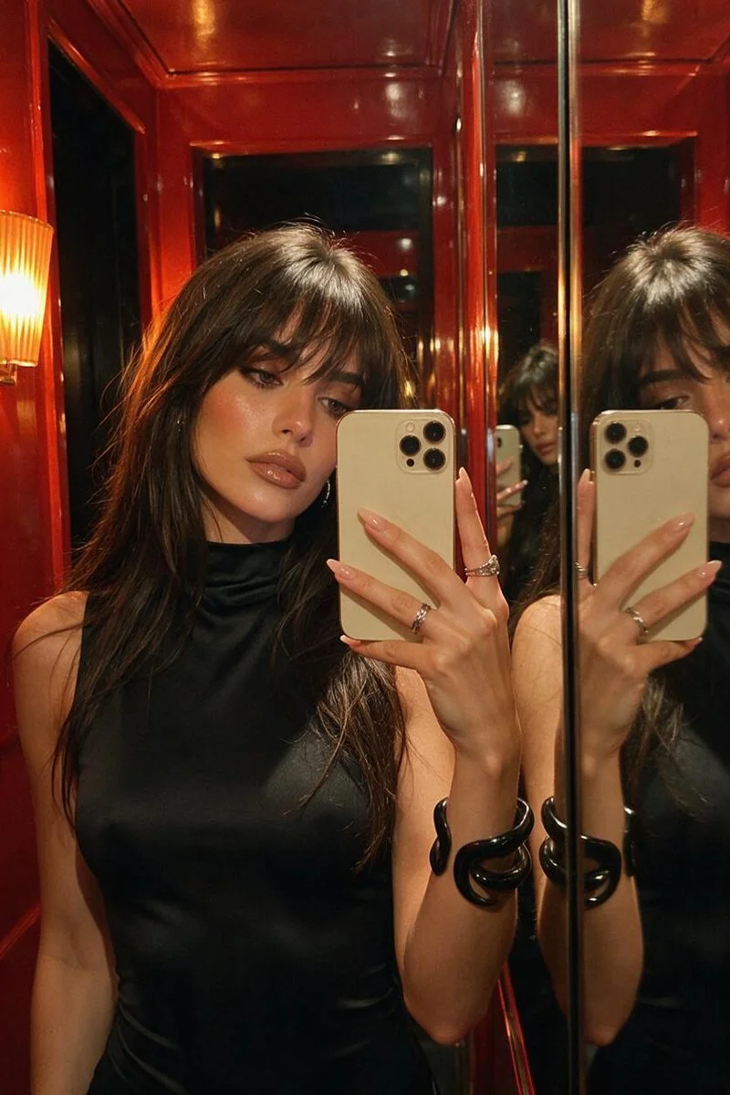 Sultry Mirror Selfie Captures Intimate Backstage Glow in Red Room