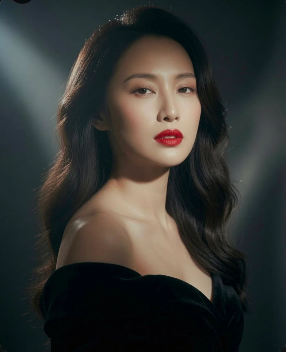 Timeless beauty exudes confidence in a chic off-shoulder dress.