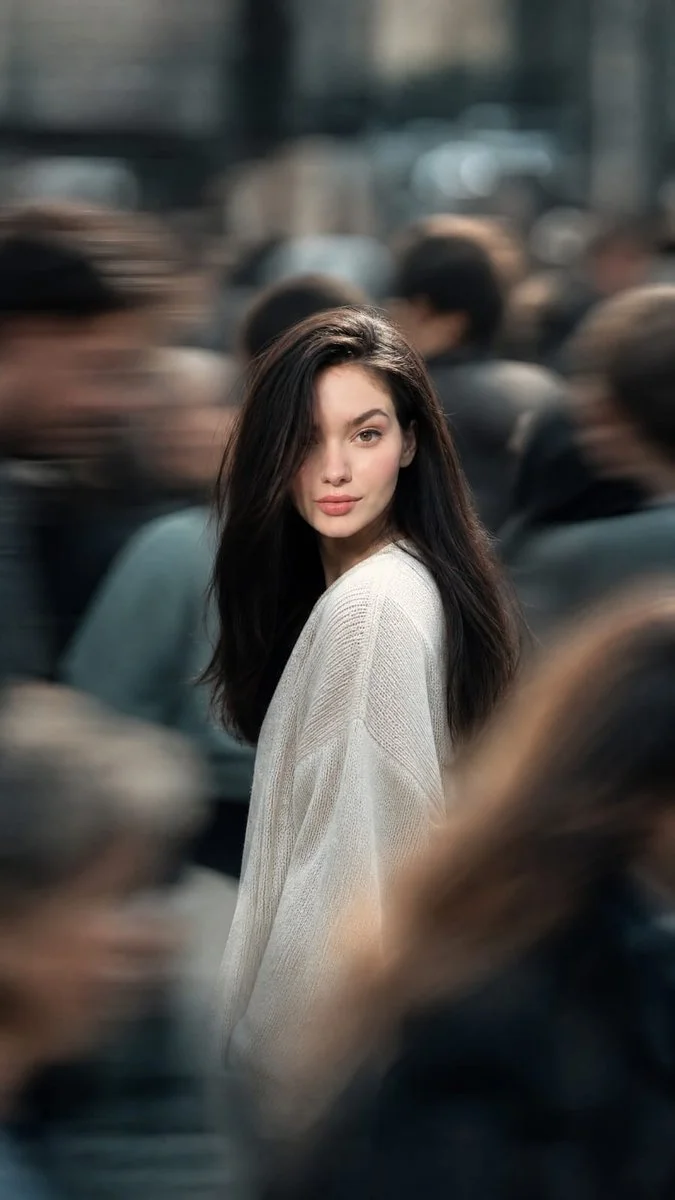 Woman in white sweater turns back on crowded city street