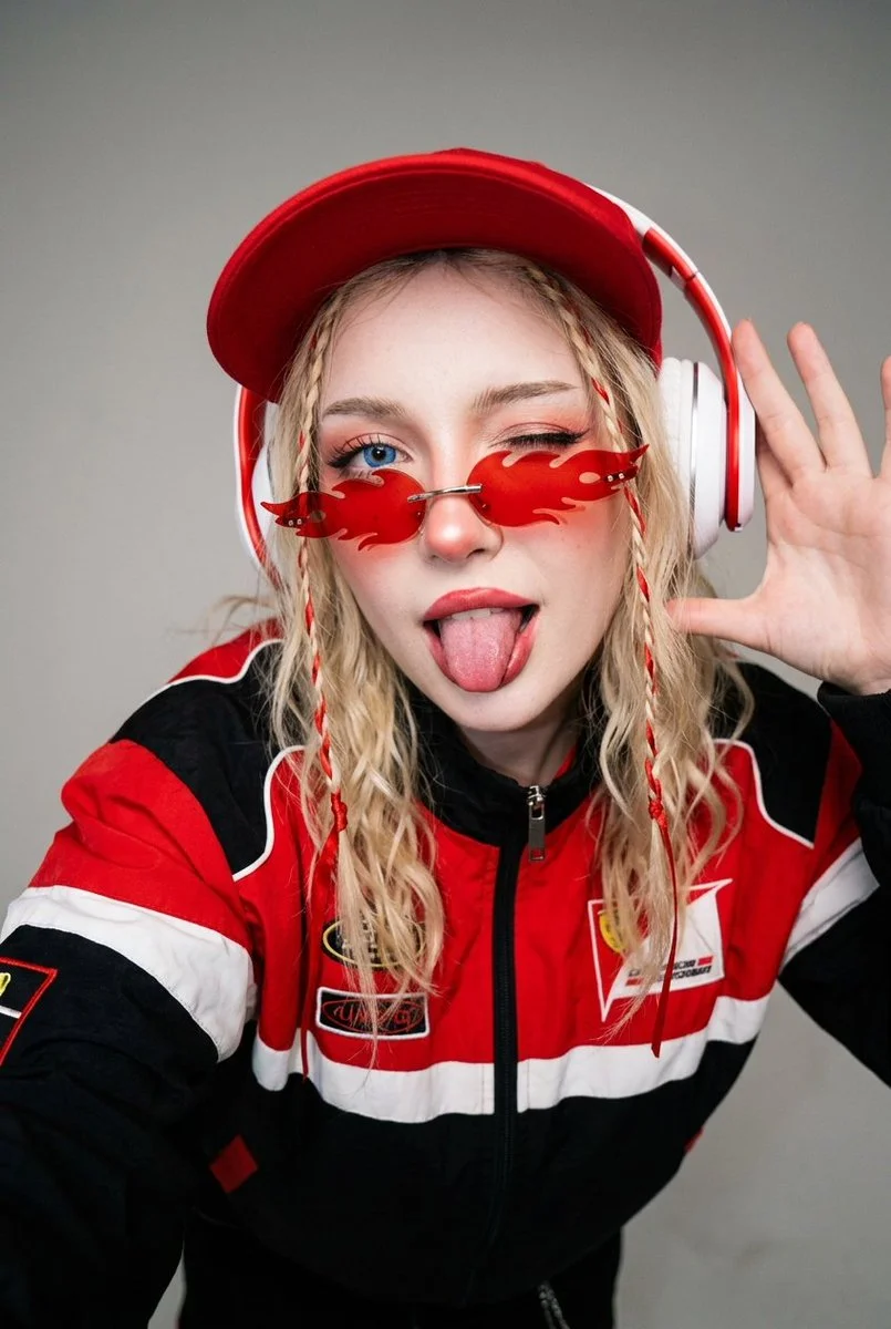 Y2K E-Girl Selfie: Playful Blue-Eyed Wink and Flame Glasses