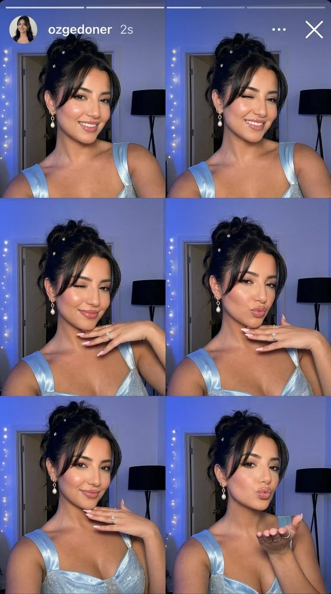 Young woman in blue glowing dress takes playful selfies at night